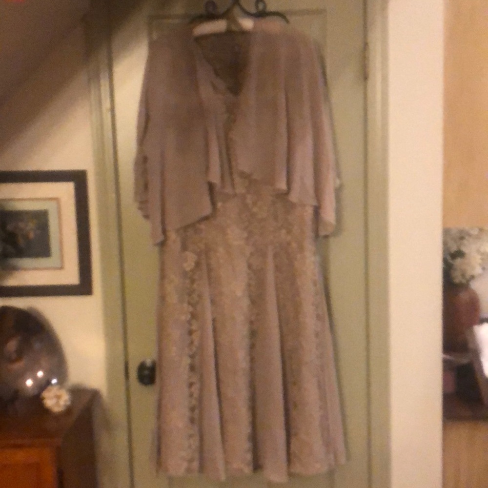 Mother of the bride dress. Taupe with lace. Has cover up. Never worn.